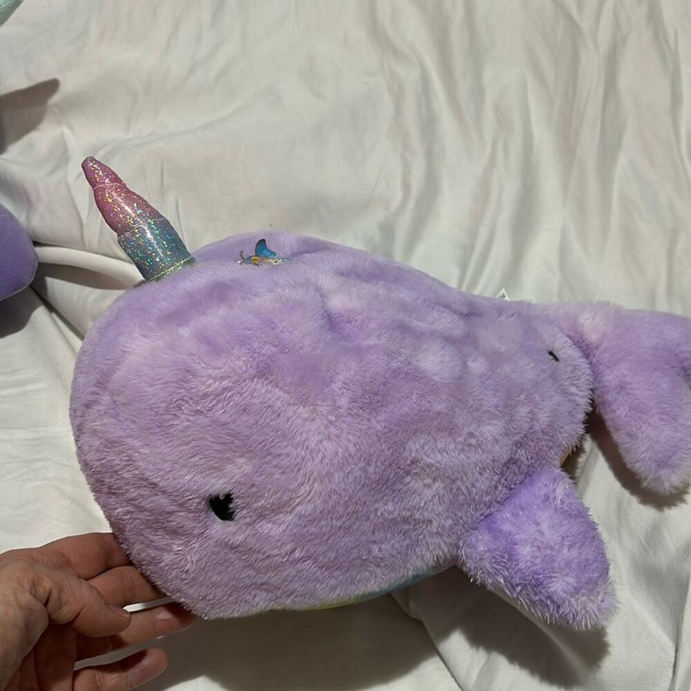 FAO Swartz purple norwal that plays a magical melody nwot and super cute